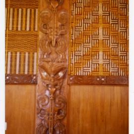 Carved post and tukutuku panels at Te Maungarongo