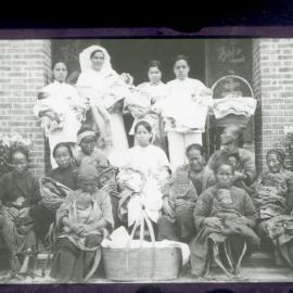 Nurses With Villagers And Babies