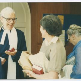 Rev. David Steedman speaking to a woman