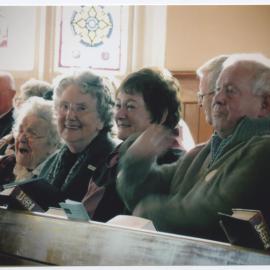 Sitting in the pews at the 150th Anniversary Service
