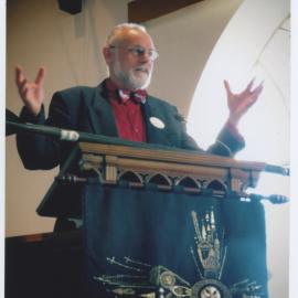 Rev. Dr Yeoman preaching with an oar