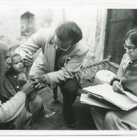 Dr Parmalingam treating a baby