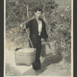 Man Carrying Baskets