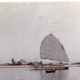 Travelling sampan with sail out