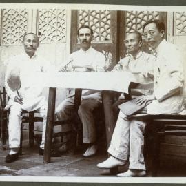 "Working on a Book Of Order," Reverend George Hunter McNeur and three Chinese pastors, 1910