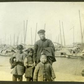 "Boatman," Unidentified Chinese man with three unidentified Chinese children