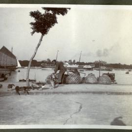 Unidentified man stands next to shipping canal in Canton