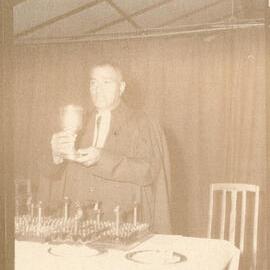 Rev. C. P. Maitai Serving Communion