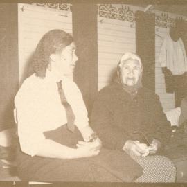 Two women in meeting house