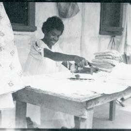 House girl ironing