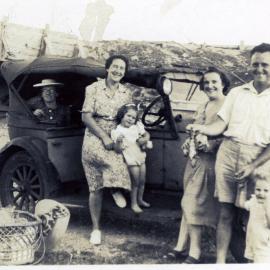 Group photograph by car