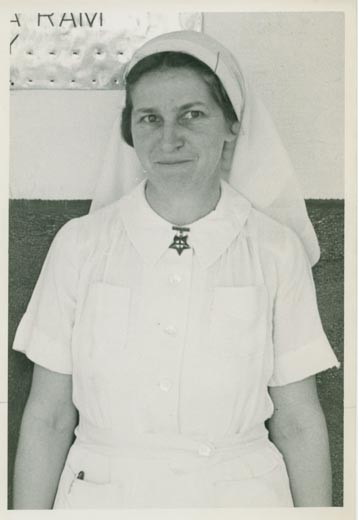 Sister Lorna Aberley, wearing nurse's uniform, cap, and badge, circa 1950.
P-A12.13-38