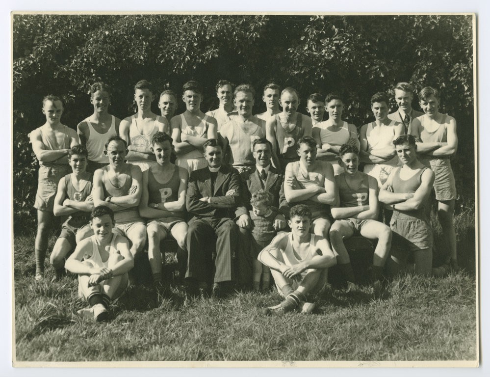 Dunedin Presbyterian Bible Class Harrier Club at St Clair Church, with Rev DB Martin, President, seated at centre, 1952.
P-A49.25-40