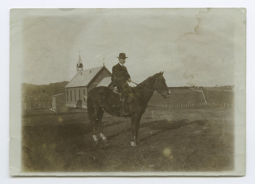 Rev. John Chisholm on his horse in front of the Owaka Presbyterian Church, the last view before the church was removed from its old site, 1907.
P-A50.1-4
